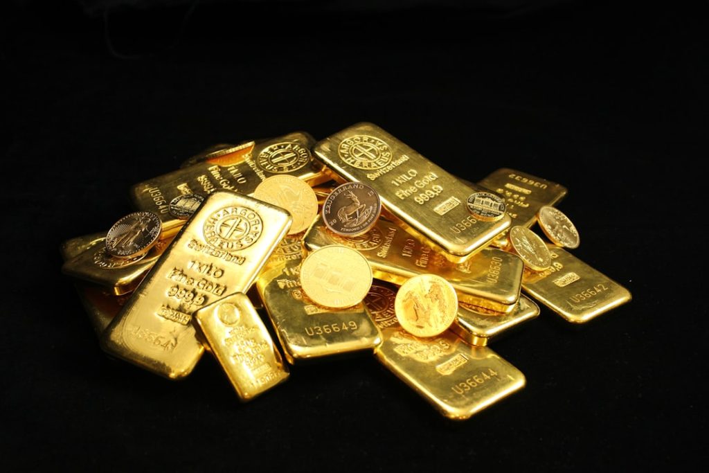 Pile of gold bullion coins and bars. Argor Heraeus, Münze Österreich, Royal Canadian Mint, U.S. Mint, Australian Mint of Perth, panda and Krugerrand. If you use our photos, please add credit to https://zlataky.cz, when possible